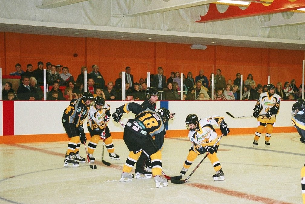 ice rink with hockey players